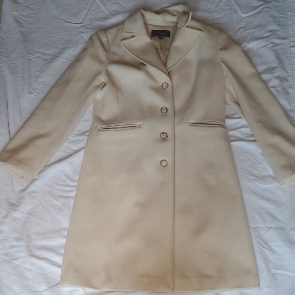 Cream colored trench coat